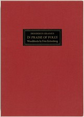 This is a photograph of a red book cover. The cover features a rectangular black label in the center with text in gold lettering. The design is minimalistic with a focus on the contrast between the red fabric and the label.