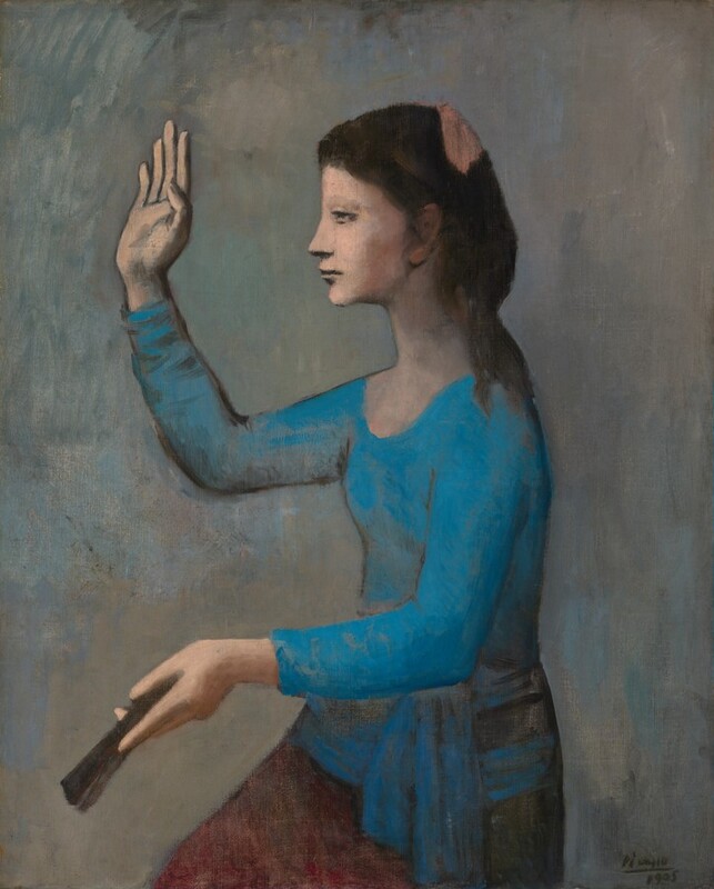 Shown from the thighs up, a woman faces our left in profile as she lifts up one hand and holds a closed fan in the other in this vertical painting. The woman has pale, peachy skin, and her dark hair is tied with a pink bow at the back of her crown. She looks to our left with heavy-lidded eyes. She has a delicately pointed nose, and her lips are closed. Her electric-blue, long-sleeved shirt is tight fitting and has a scooped neck. A blue cloth ties around her waist and falls over a brown skirt. One knee juts forward. Her right hand, farther from us, is held face-high with the palm facing away. The fan is held out in the other hand in front of the woman’s waist. The background is streaked with smoky blue and gray. The artist signed and dated the lower right corner, “Picasso 1905.”