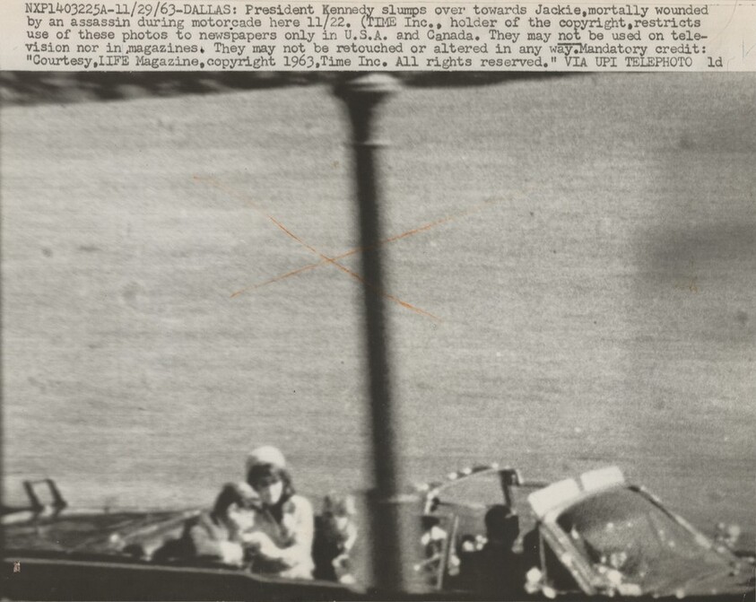 Title from caption on object: “President Kennedy Slumps over toward Jackie, Mortally Wounded...”