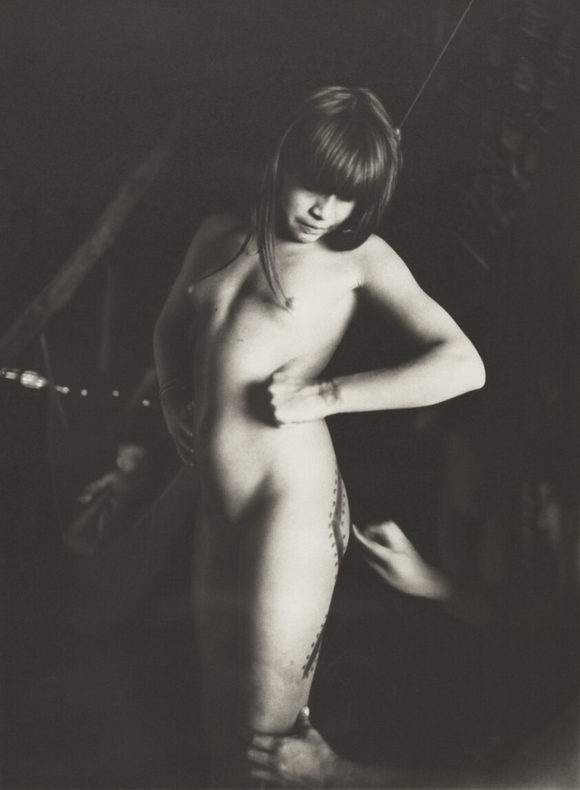 Preparing a young girl for the final stage of the Amuricumã ceremony at the Kamayura village. Upper Xingu, Mato Grosso, Brazil.