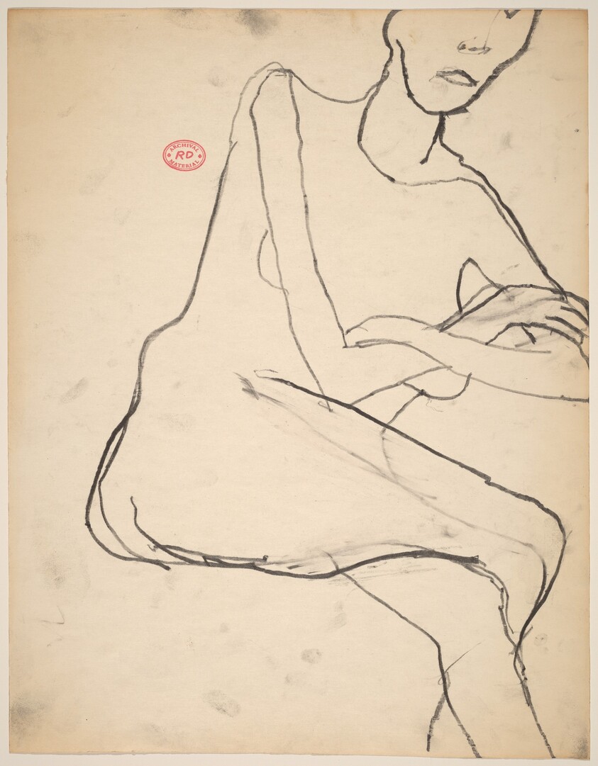 Untitled [seated model with her legs and arms crossed]