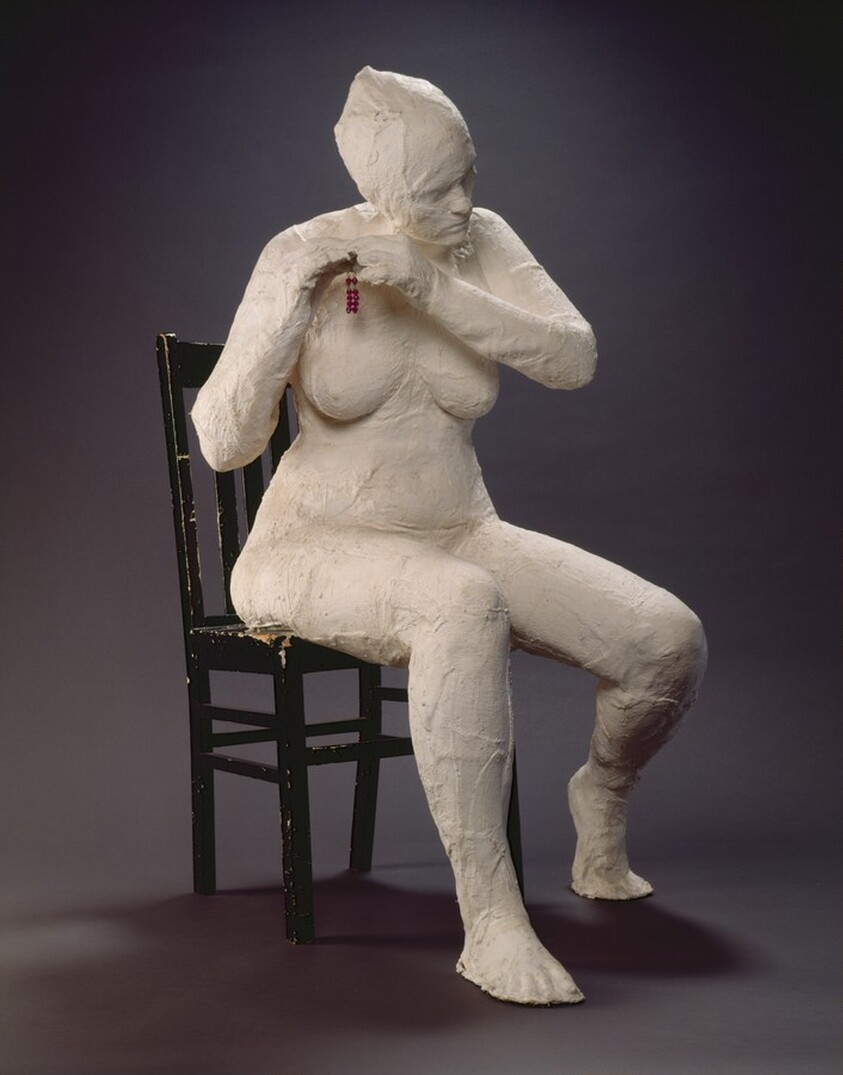 Girl Putting on an Earring