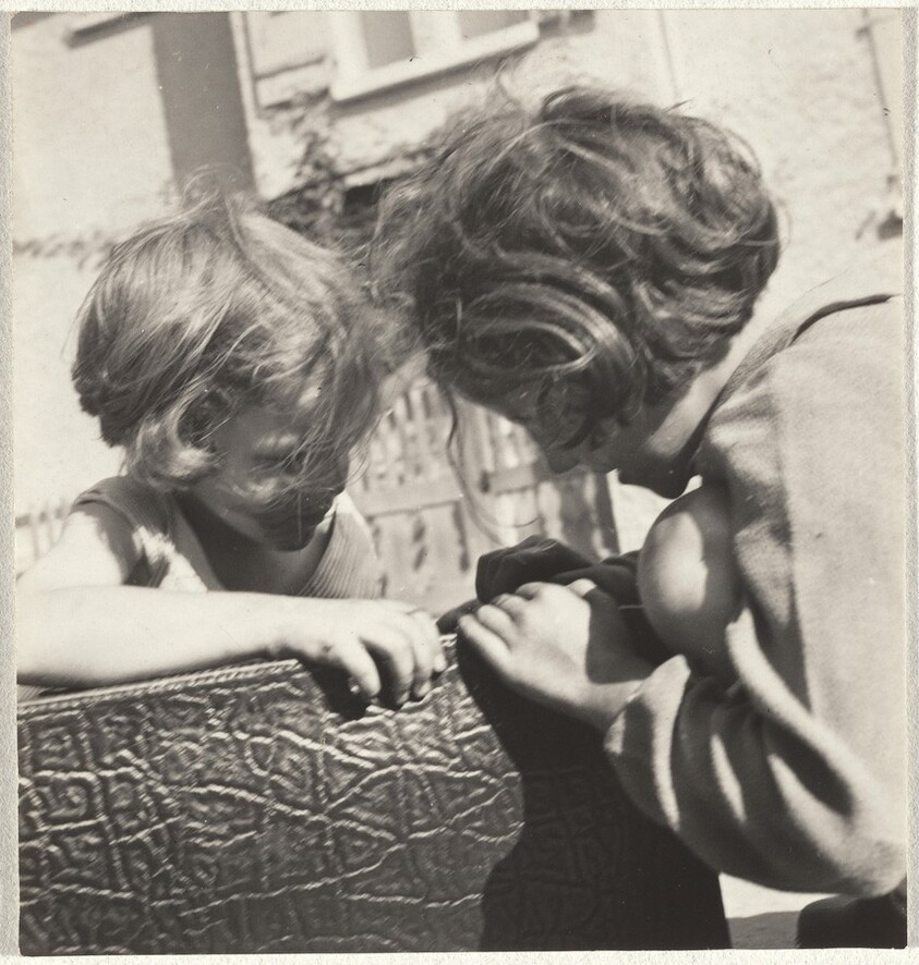 Children playing with suitcase