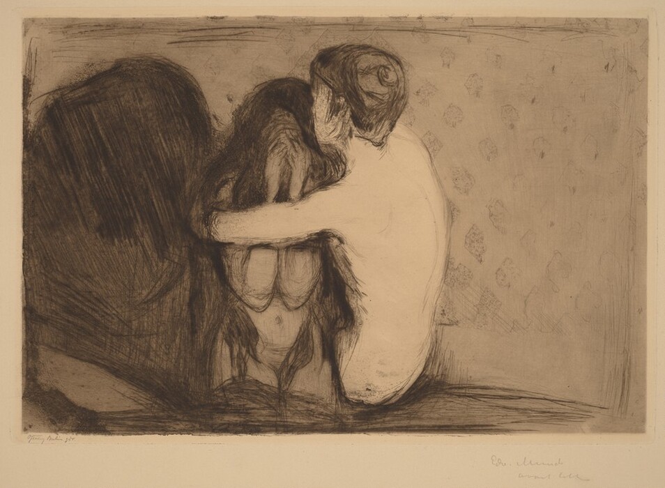 Printed with black lines and gray tones, one person wraps their arms around the shoulders of another person, who holds both hands to their face in this horizontal aquatint and drypoint. Both are nude. The person covering their face has long hair that drapes heavily over her head and shoulders and reaches her hips. She kneels and faces us, her face entirely hidden by her hands. The other person, to our right, has short hair and is angled away from us. A dark, rounded form nearly fills the left third of the composition. The wall behind the pair is patterned with faint, diamond shapes. The artist inscribed the print under the lower left corner and signed the bottom right in graphite. The only fully legible text is his name, “Edw. Munch.”