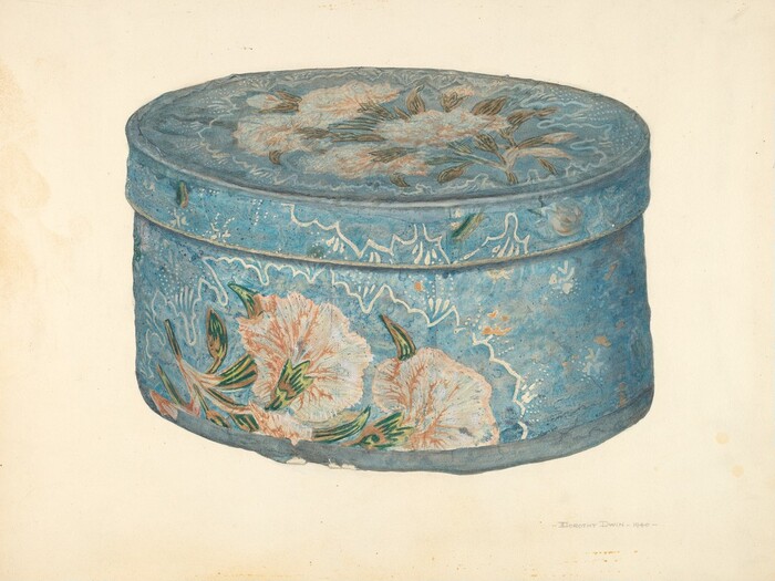 The image shows a large, oval-shaped blue box with floral patterns as the main subject. The color palette includes soft blues, whites, pinks, and greens, which are used in the floral designs that adorn the box. The box is centered in the image, with the oval lid slightly raised, and the floral patterns spread evenly across the surface.