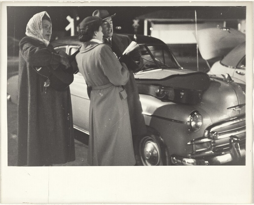 Group near automobile at night--Nevada