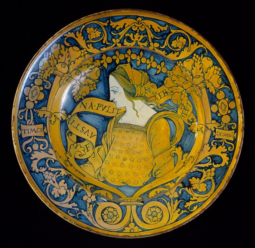 Large dish with border of floral scrollwork and cornucopias; in the center, profile bust of "Faustina"
