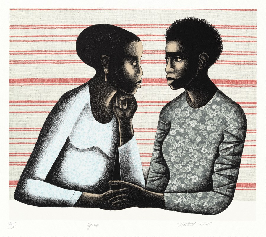 A man and a woman looking into each other's eyes with serious expressions on their faces. 