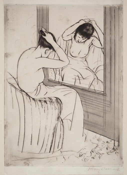 Nude from the waist up, a woman gathers her hair in her raised hands as she sits before a mirror in this vertical print. The large mirror is to our right, and the woman’s body is mostly turned away from us. Her head is bowed but a loose tendril of dark hair hanging beside one cheek is reflected in the mirror. Her lower body is wrapped in a voluminous cloth as she leans forward on a curved, upholstered armchair. Her facial features, the contours of her body, and the folds of the towel are all delineated with thin black strokes. The mirror is set into a light gray wall in front of the woman but the wall to our left, past her shoulders, is blank. A few inscribed lines suggest a floral pattern on the floor beneath her bare feet. The artist signed the work in graphite under the lower right corner, “Mary Cassatt.”