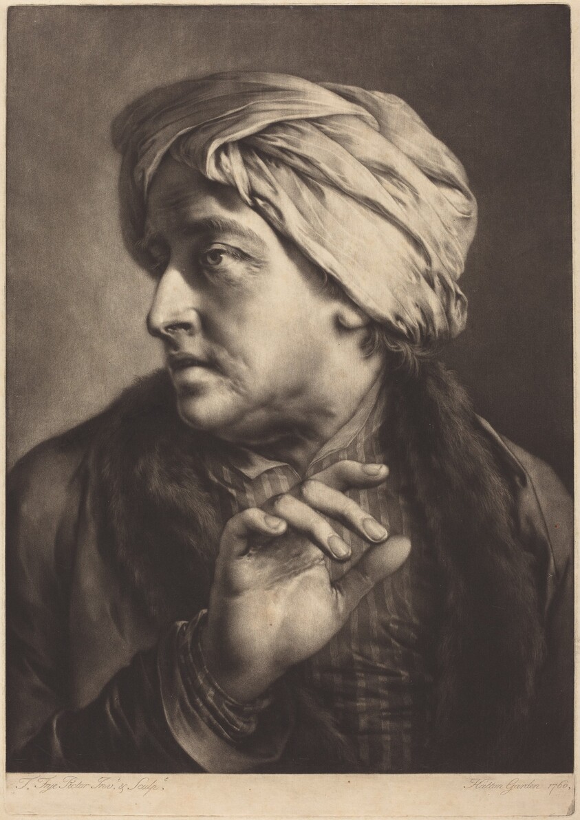 A Man with a Turban and Striped Shirt