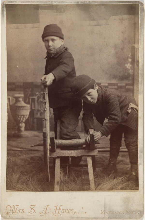 Portrait of Children Sawing Wood