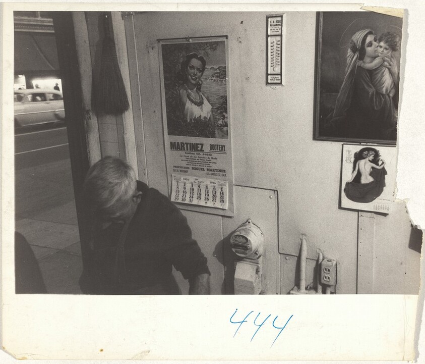 Man in interior with wall calendar--Los Angeles