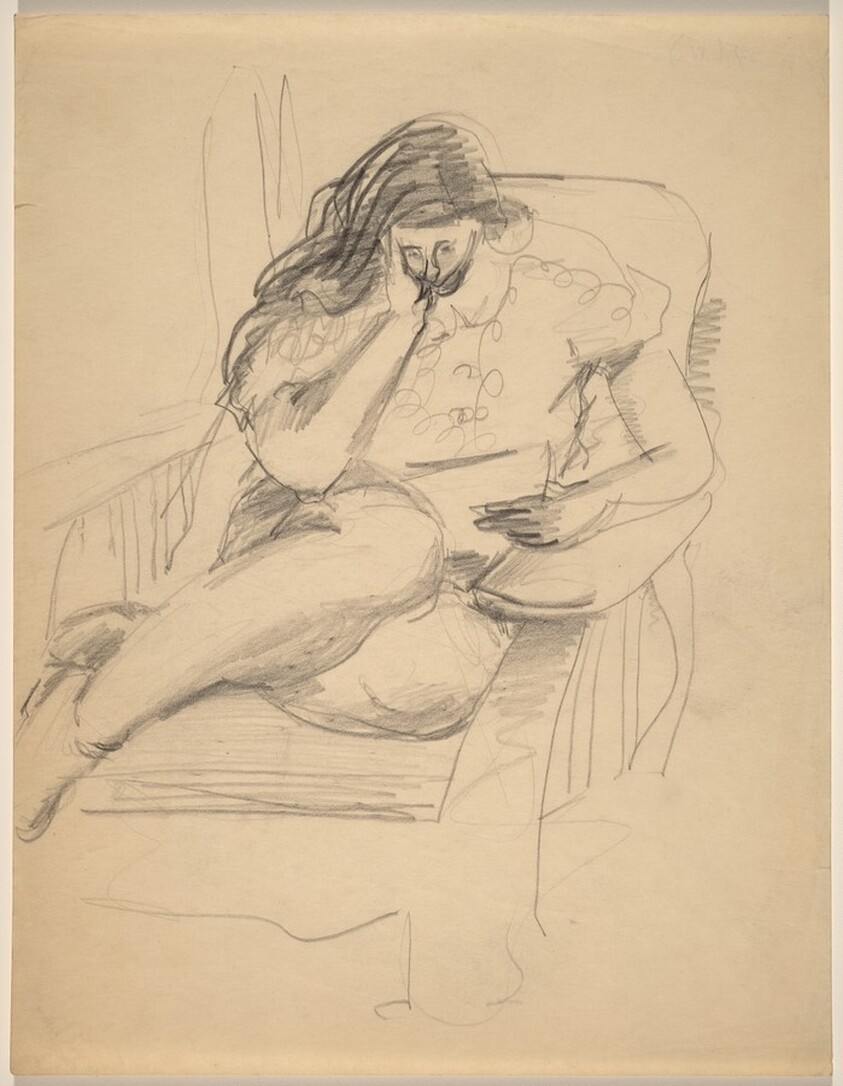 Woman Curled Up in Large Chair, Reading