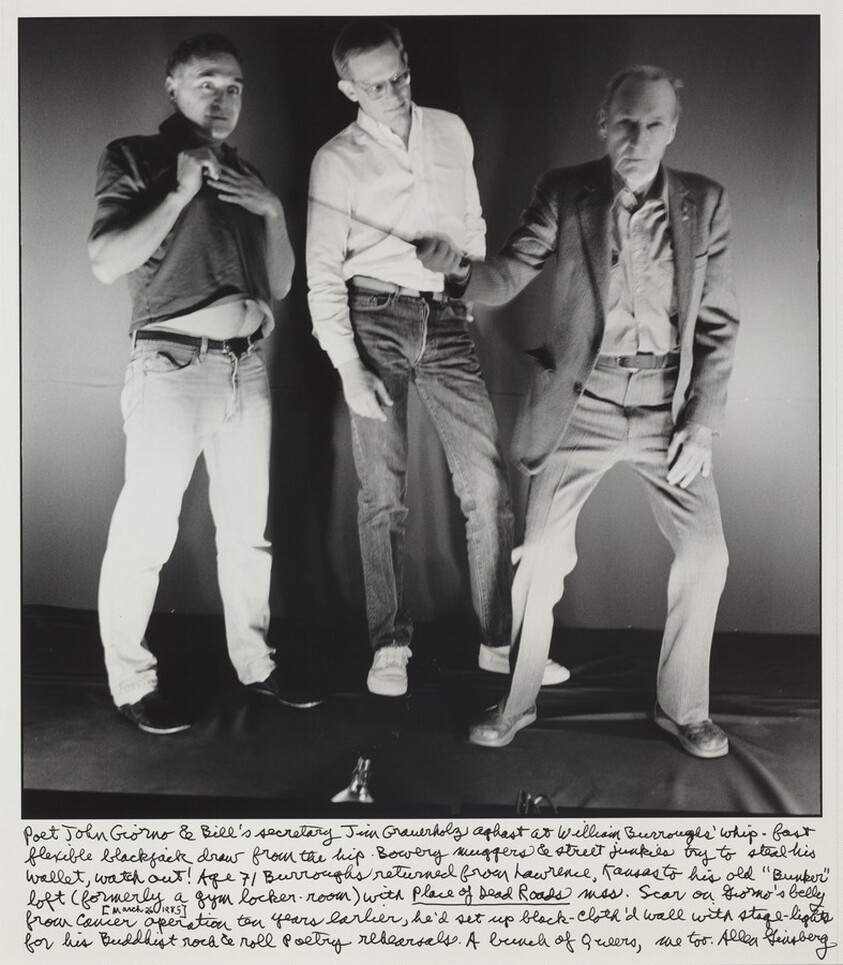 Poet John Giorno & Bill's secretary Jim Grauerholz aghast at William Burroughs' whip-fast flexible blackjack draw from the hip. Bowery muggers and street junkies try to steal his wallet, watch out! Age 71 Burroughs returned from Lawrence, Kansas to his old "Bunker" loft (formerly a gym locker-room) with _Place of Dead Roads_ mss. Scar on Giorno's belly (March 26, 1985) from cancer operation ten years earlier, he'd set up black cloth'd wall with stage-lights for his Buddhist rock & roll poetry rehearsals. A bunch of Queers me too.
