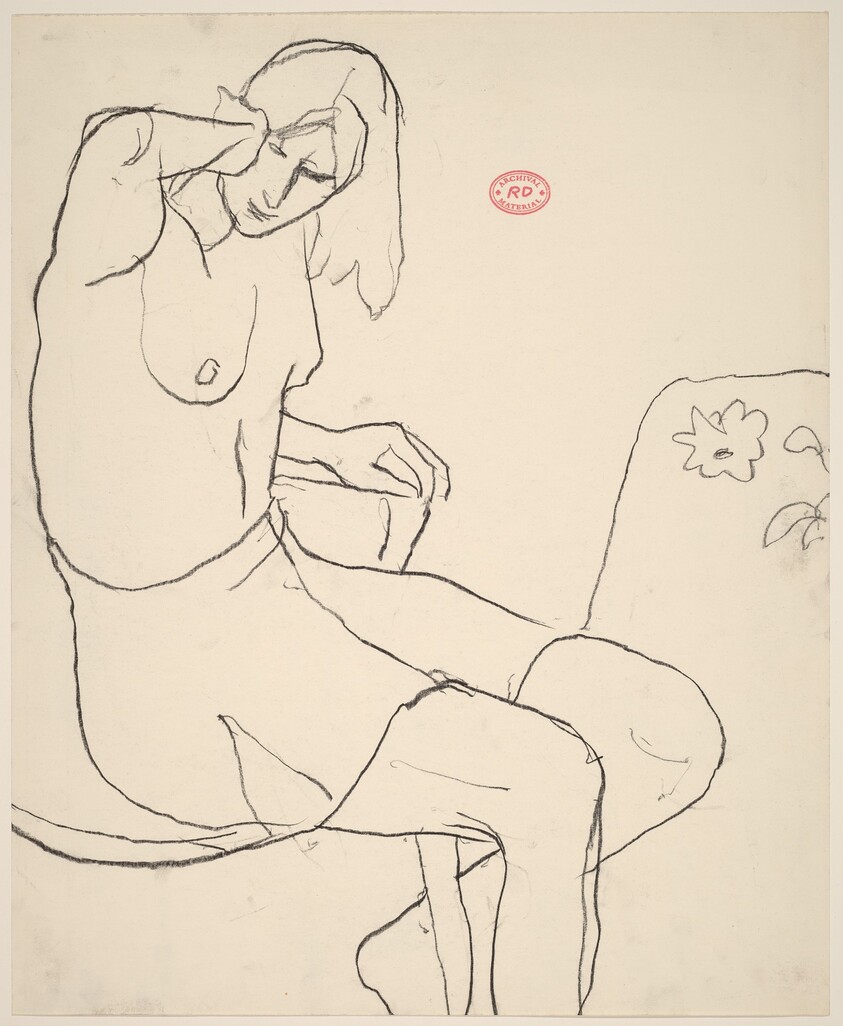 Untitled [seated female model without a top and wearing a skirt]