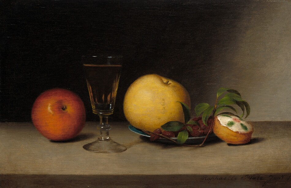 This painting is a still life featuring several objects arranged in a line. On the far left is a red apple with its stem toward us. Next to it is a transparent glass goblet with a hint of golden liquid inside. To the right of the glass is a blue plate with a large yellow apple next to what look like dark red dates or raisins. Resting beside the plate is a thin brown twig with green leaves. Farthest to the right is a small round yellow cake with white frosting, decorated with a pink dot in the center of the frosting and four green ovals around it. The surface these objects rest on is light gray, and they cast dark shadows, indicating light coming from the left. The wall behind the objects is mostly black, which transitions into a lighter gray color on the far-right side of the painting.