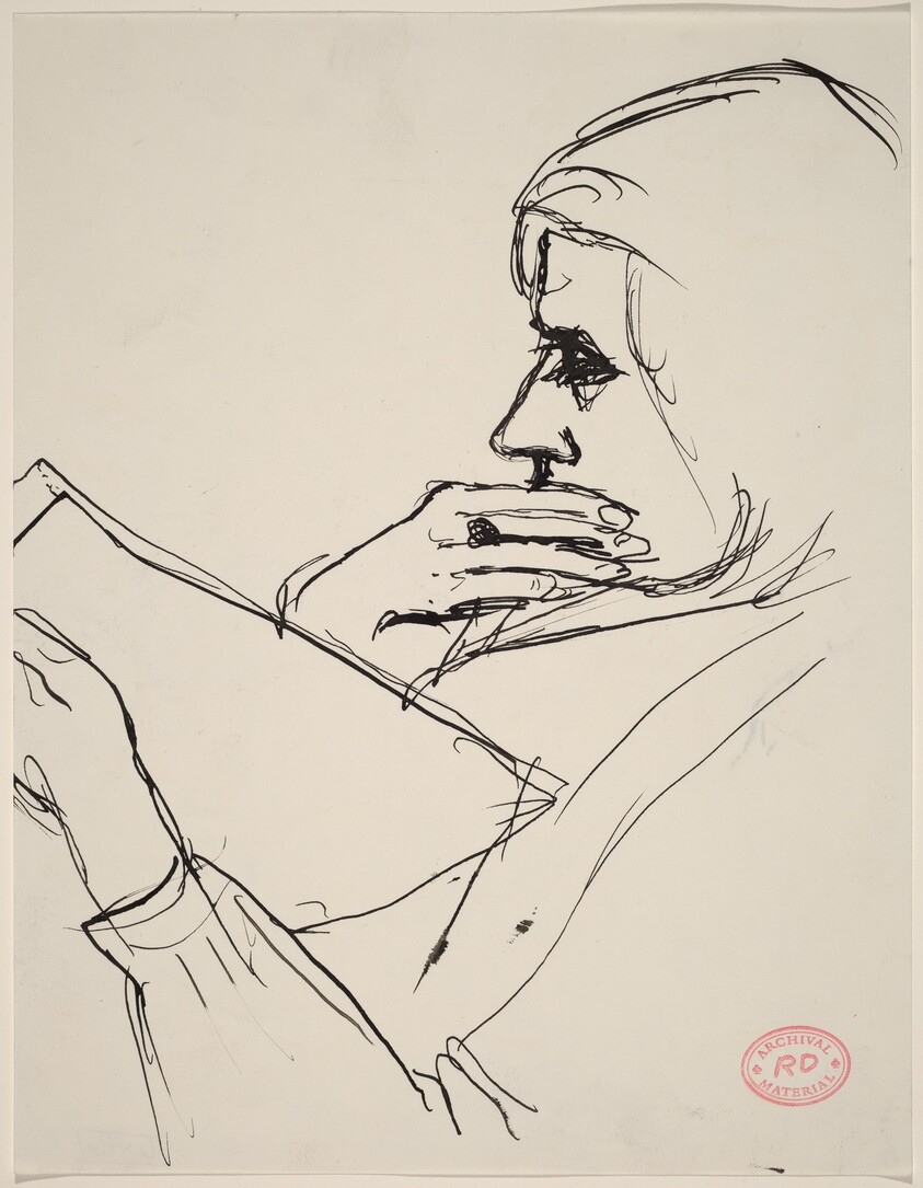 Untitled [woman holding her chin and reading]