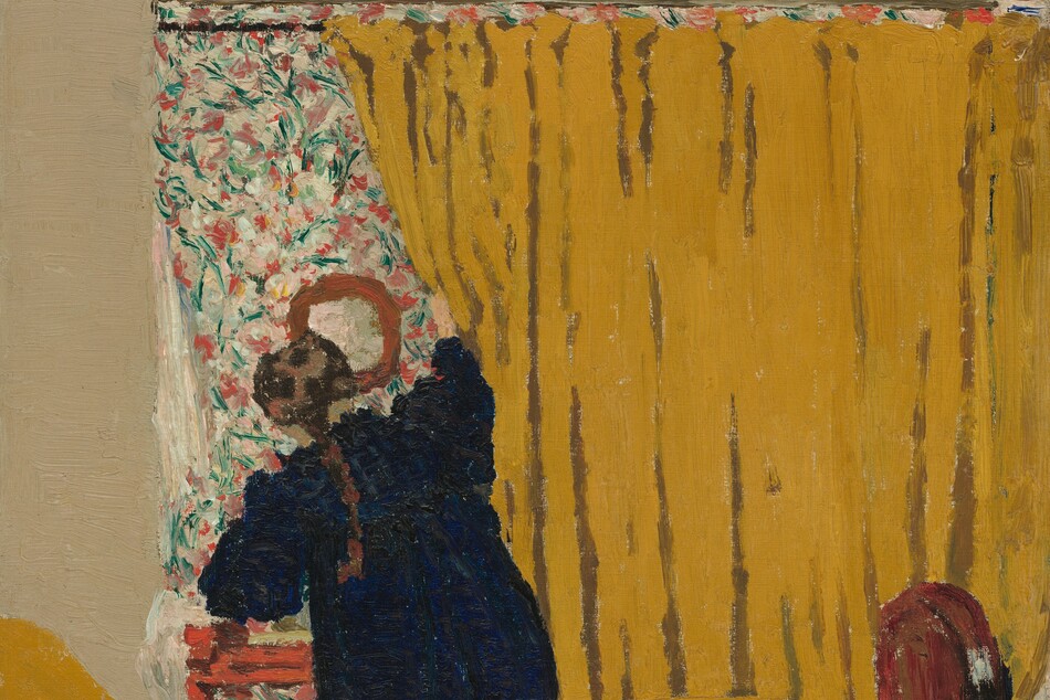 A woman pushes aside a deep golden yellow curtain that fills three-quarters of this nearly square painting. The curtain runs on a rod parallel and close to the top of the canvas, extends off the right edge, and falls behind a bed covered in the same color. The bed is cropped by the bottom and left edges of the painting, and a brown, arched wood footboard almost reaches the right side. The woman stands on the far side of the bed, facing away from us as she pulls at the curtain with her right hand. She wears a navy-blue dress and a brown braid falls down her back. She reveals an area covered in a pink, green, and white floral pattern that seems to match the size of the curtain, at least along the left edge where it is exposed. A round mirror hangs on the floral-patterned area above a red piece of furniture, perhaps a small table or stool. The wall around the patterned area and curtain is painted bone white. A line incised in the paint running from the top left corner of the floral area to the top edge of the canvas suggests a crack in the wall. The paint is loosely applied so brushstrokes are visible throughout, especially in the floral pattern. The artist’s signature is painted in red in the lower left corner: "E. Vuillard."