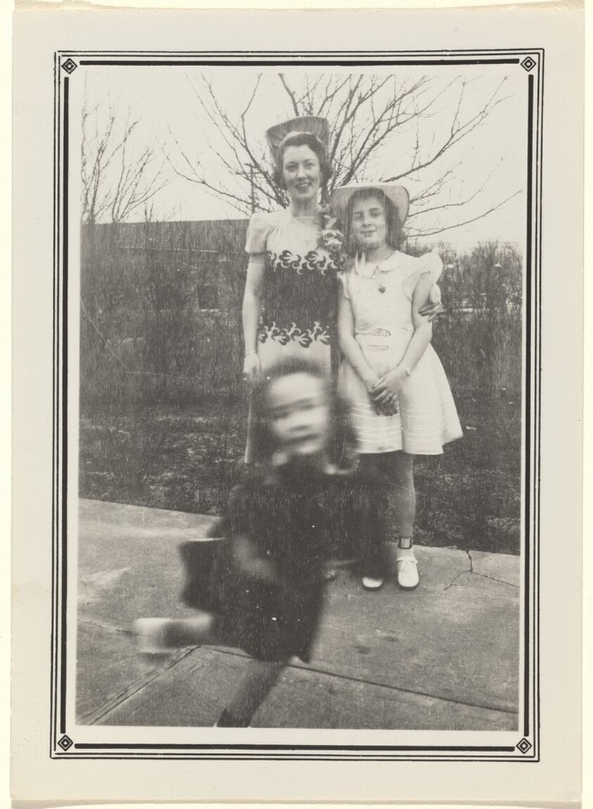 Untitled (Blurred girl in front of woman and girl posing)