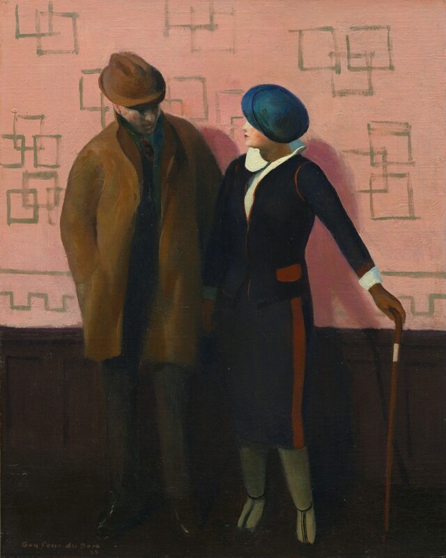 A man and woman stand against a wall with dark brown wainscoting and rose-pink wallpaper in this vertical painting. Both people have pale, peachy skin and wear hats that hide their eyes. The man is to our left and wears a brown fedora and a thigh-length, brown coat over a dark suit. He appears to look down at the woman’s body with his head tipped toward us. His right hand, to our left, is in his coat pocket. The woman’s right arm, to our left, overlaps the man’s other arm. The woman is shorter than the man but stands with her shoulder almost touching his arm. Her left arm, to our right, is stretched out and that gloved hand rests on the head of a cane. Shown in profile, the woman looks at the man’s face. She has a delicate nose, and her small red lips are closed. Her shirt has a round collar that lifts off her shoulders. She wears a navy-blue jacket with brick-red piping and a blue, shin-length skirt with a red stripe down the side. Her stockings are sage green, and she wears dark, T-strap shoes. The pink wallpaper behind them is loosely patterned with overlapping olive-green-outlined boxes. The artist signed and dated the lower left corner, “Guy Péne du Bois 22.”