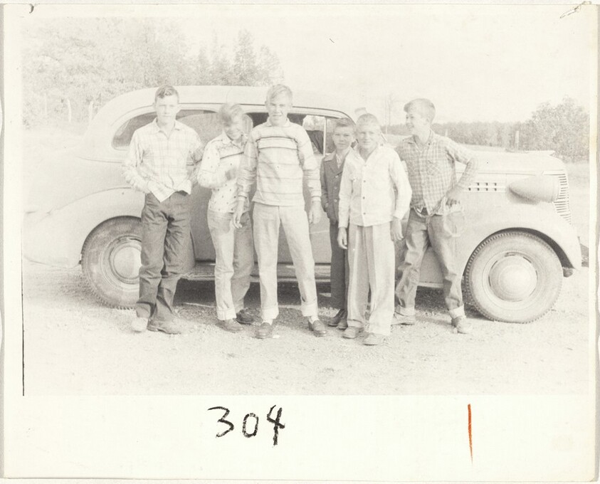 Boys standing beside automobile--Alabama
