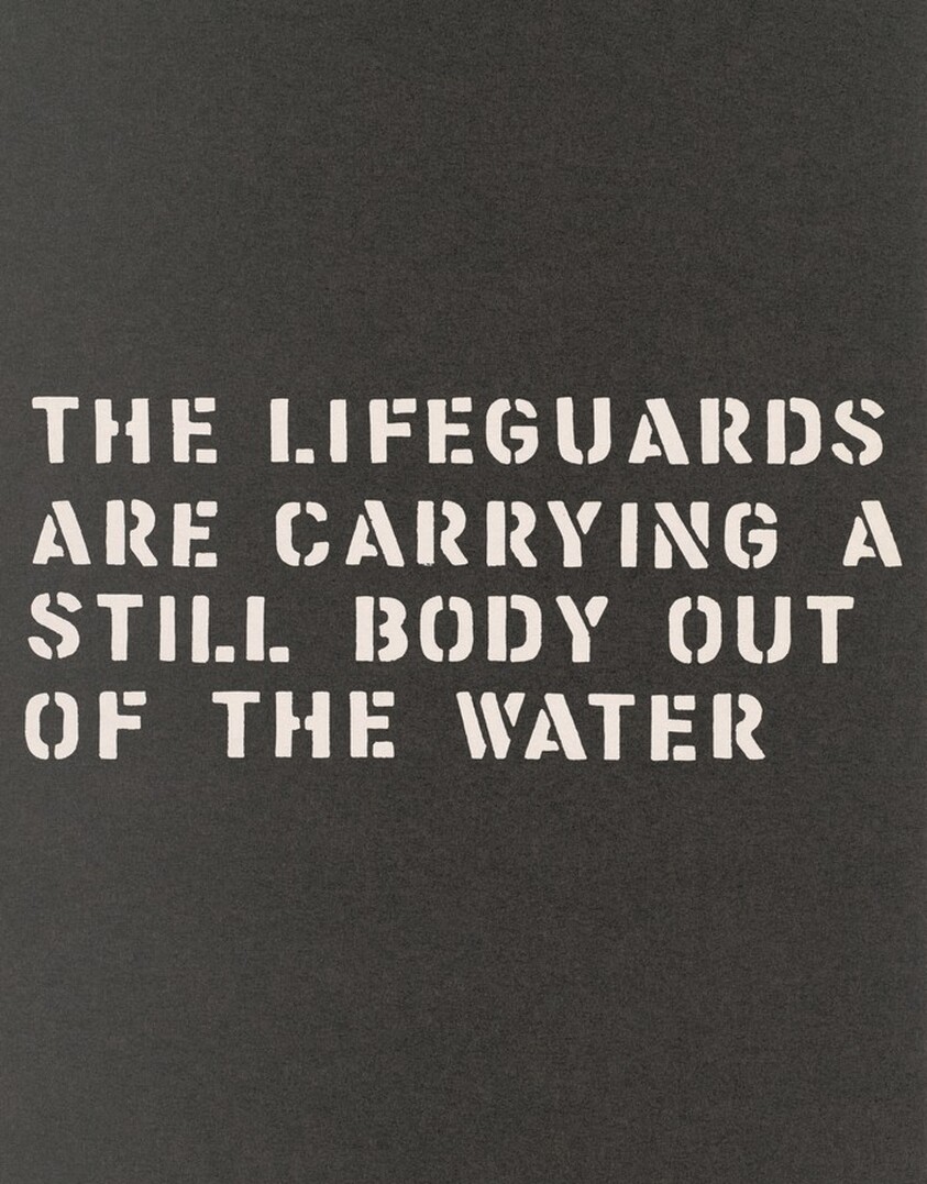 A Performance:The Lifeguards Are Carrying a Still Body Out of the Water