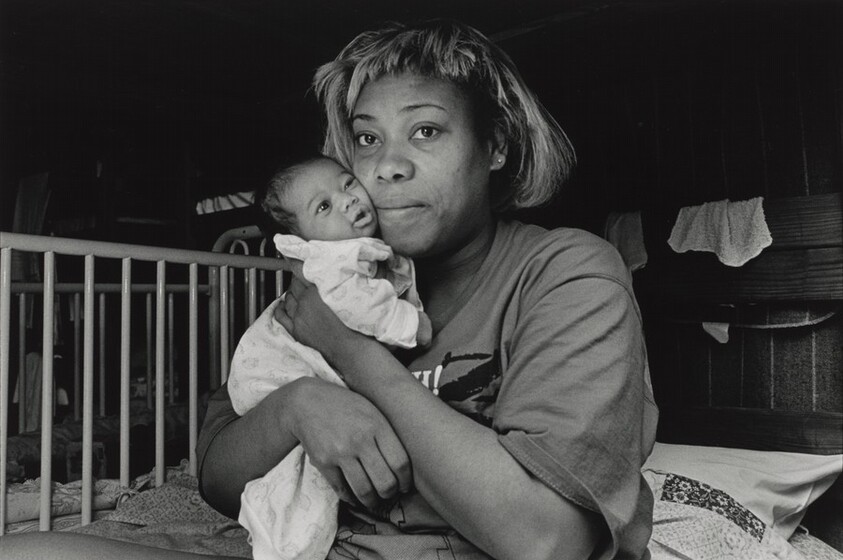 It's 3:00 a.m. No way to sleep. Imaginary bedbugs chewing at me. The air is oppressive, like being buried alive. The cries of asthmatic children sniffling, screaming, sleep-talking keeps me on edge. In semi-darkness I wander among the beds, seeing mothers wrapped around their babies, like bears in hibernation. In one lower bunk, I find an exhausted mother, Pam, rocking her wailing week-old daughter. Pams face glows with inner peace. She is one of the lucky ones. She escaped an abusive relationship and found shelter here. Olive Branch Mission, Chicago.