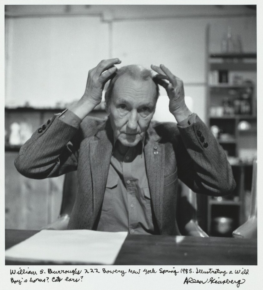 William S. Burroughs 222 Bowery New York Spring 1985. Illustrating a Wild Boy's horns? Cat's ears?