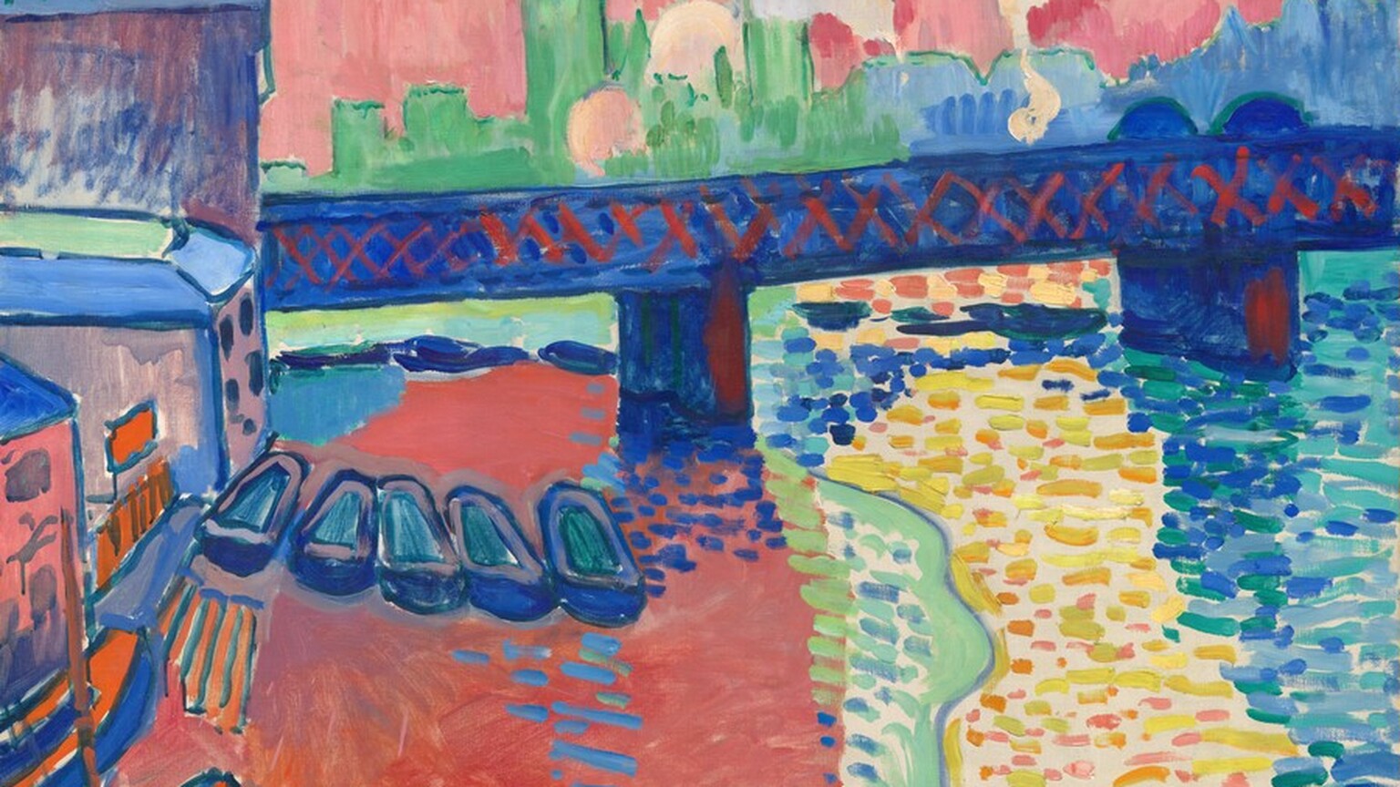 We look across river at a bridge with a city skyline beyond in this stylized, horizontal landscape, which is painted entirely with broad, visible brushstrokes in vivid, saturated colors. The river spans nearly the width of the canvas, and the riverbank is lined to our left with a row of several buildings between us and the bridge. Those buildings are outlined with royal blue and filled in with mostly flat areas of color in coral pink, mint green, tangerine orange, and pinkish tan. Letters across the top of the building farthest from us reads “BREVER.” Eight boats are tied up at the foot of the buildings. The pointed hulls of three extend into the scene from the lower left corner, painted in marigold orange and outlined in cobalt blue. Five more boats, with rounded prows and hulls and painted with lapis blue and muted aqua, line up like a row of empty shoes. The bridge runs from behind the tallest building to our left across and off the canvas, and is painted with deep lapis blue with crimson-red Xes crisscrossing the span to suggest trestles. The front faces of the pilings below are also highlighted with  red. The river fills most of the bottom half of the painting. The water to our left is painted as a field of coral pink with a few, short horizontal baby and cobalt-blue strokes, suggesting reflections of the boats and a bridge piling. A narrow band of kiwi green and sky blue lines the pink field to our right. Next to it, the water is painted as short, horizontal, disconnected strokes and dots mostly in bumblebee yellow with some strokes in bubblegum pink and pale burnt orange, all against the off white of the canvas below. The final zone, to our right, is more densely painted with short dashes in indigo, turquoise, and aqua blue. Beyond the bridge, the skyline is painted in silhouette with spiky spires to our left in mint green and a mass of shorter buildings in periwinkle blue to our right. Four clouds of pale yellow billow off the bridge in front of the skyline. The sky above is painted with short and long vertical strokes of butter yellow, rose pink, pale orange, and a few areas of watermelon pink. The artist signed the work with cobalt-blue paint near the lower left corner: “a derain.”