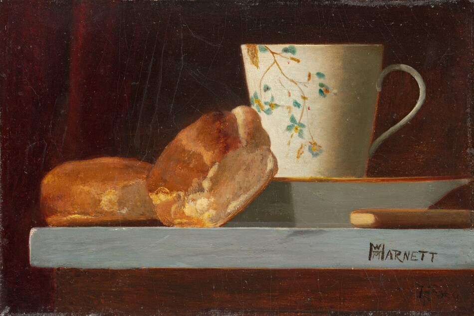 In this painting, there are two round, crusty rolls next to a cream-colored cup with a floral blue-and-yellow design on top of a saucer with a gold rim. The rolls are in the lower left, while the cup is placed slightly to the right of center. The rolls are dark brown on the top, golden on some sides, and white on the other sides. A light brown object lies horizontally on the right in front of the saucer, perhaps the handle of a utensil. The surface the objects rest on is a counter with a light blue top and a dark brown base. Behind the objects, the background is dark red with some black shadows.