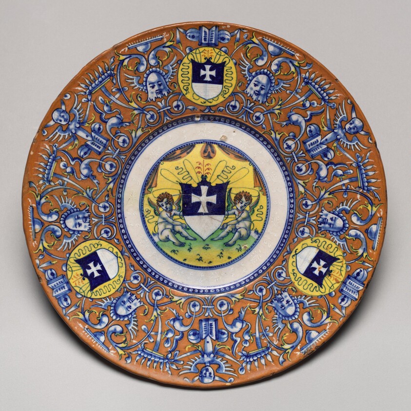 Plate with border of grotesques on an orange ground and three shields of the arms of the Gritti of Venice; in the center, putti holding another shield of the same arms