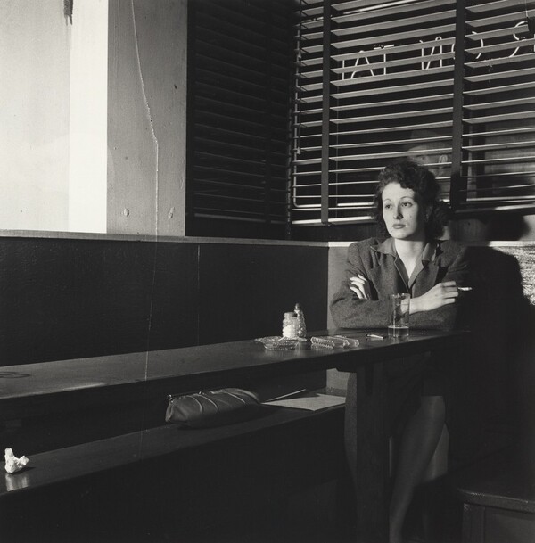 Girl Sitting Alone in the 'Sea Grill,' a Bar and Restaurant, Waiting for a Pick-up, Washington, D.C.