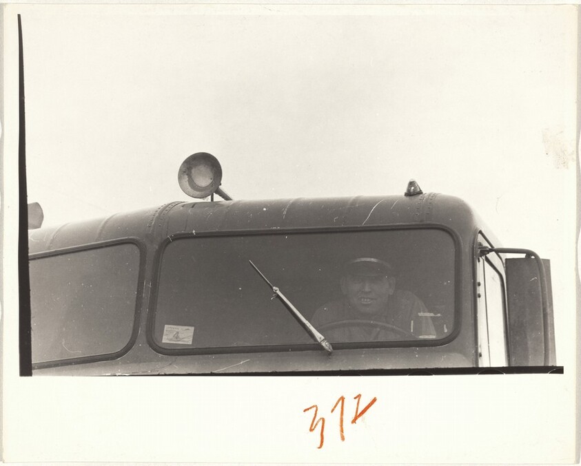 Man in uniform driving truck--New Mexico