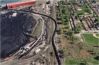 Petcoke filled train snaking through the neighborhood, Southeast Side, Chicago, IL, Terry Evans, 2015, printed 2024