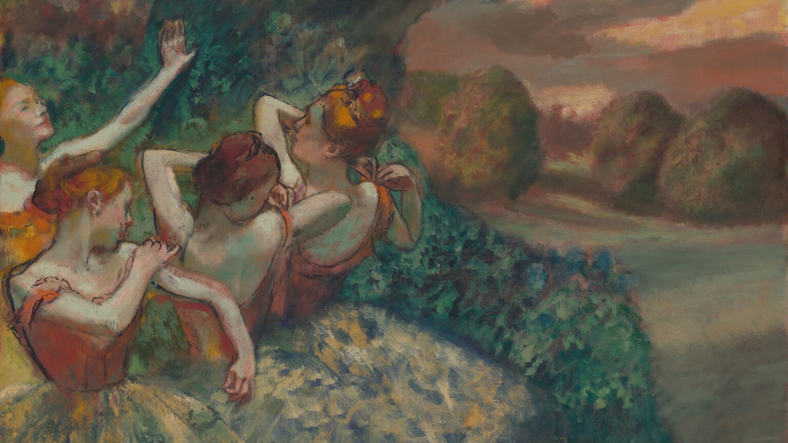 Four light-skinned ballerinas with russet-orange hair tied back in buns adjust the straps of their bodices as they gather close together, their bodies and wide, knee-length tutus taking up the left half of this horizontal painting. The background or backdrop beyond them shows a grove of deep green trees to our left and a sunset view of meadows leading back to trees to our right. Three of the dancers stand in a row that extends from the lower left corner to our right and away from us. All three wear rust-orange bodices over tutus that are painted loosely with flecks of pale celery green and buttercup yellow against a muted royal-blue background. Their bodices and upper bodies are outlined with black. The woman closest to us stands with her body angled to our right. Her face turns away as she looks to her left and adjusts that shoulder strap. The two dancers farther from us stand with their backs to us, their bodies angled away from us to our left. The middle dancer looks back over her right shoulder as she lifts the other elbow to adjust that strap. The third dancer in the row holds both hands to her right strap as she looks off into the distance, to our left. The fourth ballerina, to our far left beyond this trio, stands with the arm we can see, her left, lifted with her hand held high as she looks off to our right. Her bodice is a brighter carrot orange, and is more loosely painted. The green foliage behind the dancers extends off the top edge of the painting. The pale sage-green field to the right stretches before puffy, rounded trees daubed with mauve-pink highlights. The coral-pink and golden yellow sky is streaked with lavender-gray clouds. The artist signed his name in red paint with tiny, almost illegible letters in the lower right corner, “Degas.”