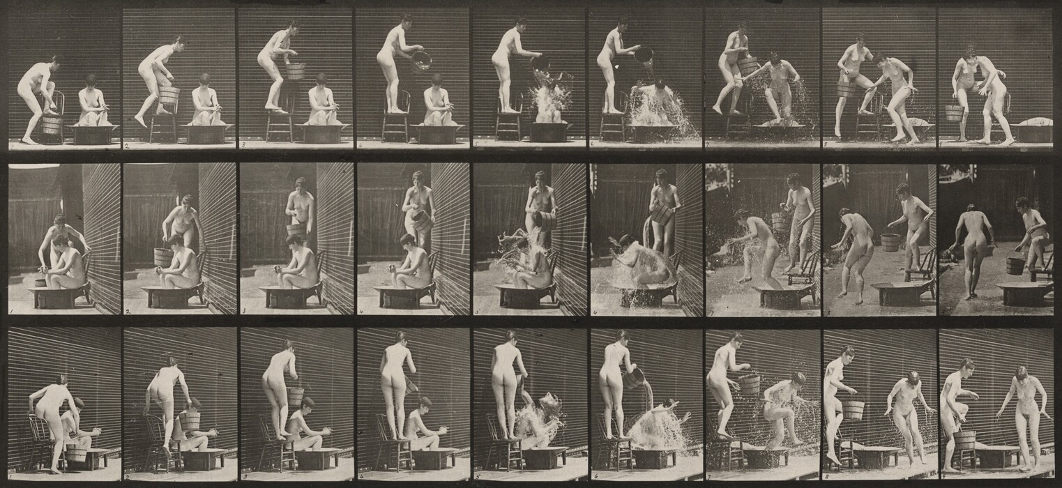 The image shows a sequence of black and white photographs featuring two nude individuals engaging in a playful water interaction. In each frame, one person is seated in a low bathtub, while the other stands nearby pouring water on them, creating splashes. Both individuals have short hair, and their facial features are visible in some frames. There is a fence or wall backdrop, suggesting an outdoor space.