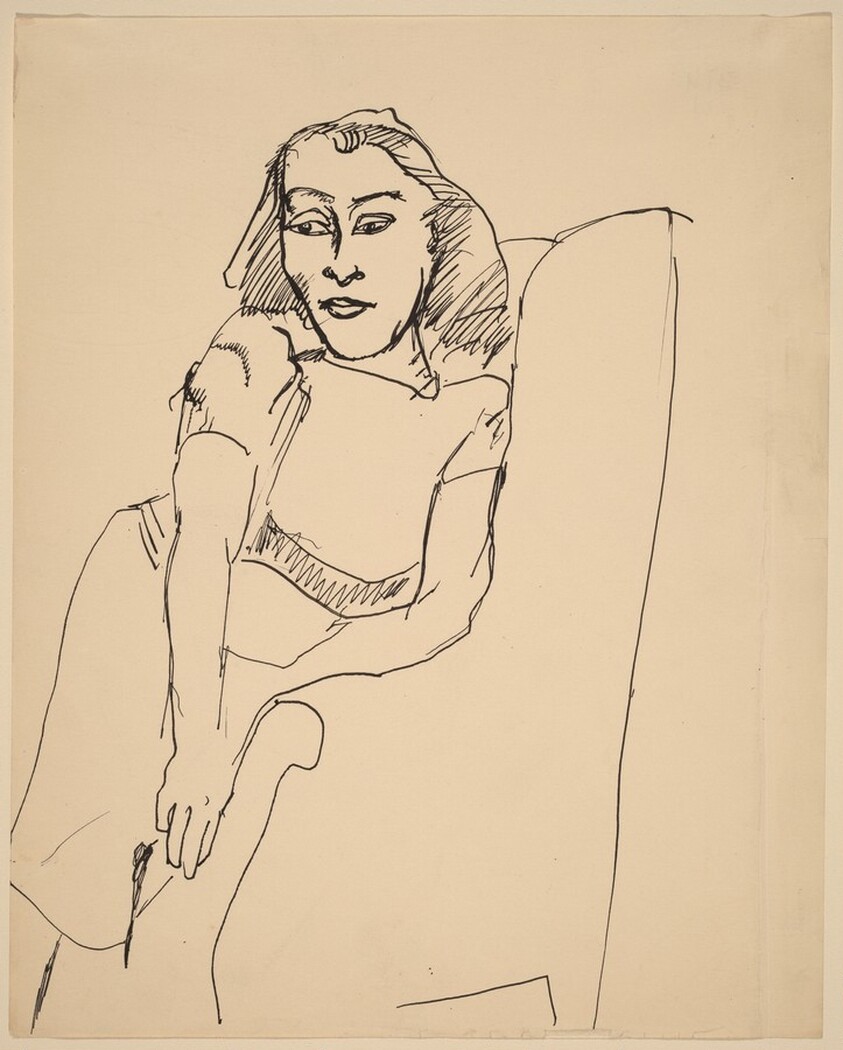 Woman Seated Sideways in Upholstered Chair