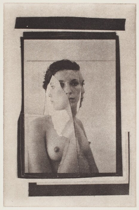 The image depicts overlapping rectangular and triangular shapes. A fragmented reflection of a human figure can be seen within these shapes, resembling a woman captured from different angles.