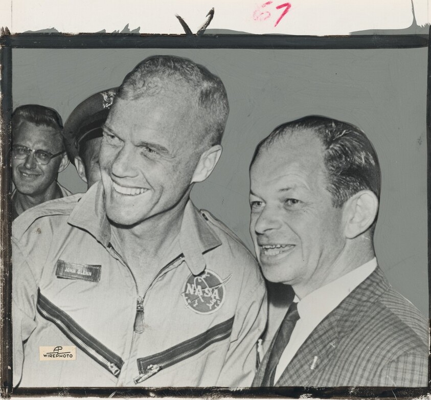 Title from caption on object: “Air Force Col. John Powers, Right, Stands by John Glenn after Glenn's Arrival on Grand Turk Island...”