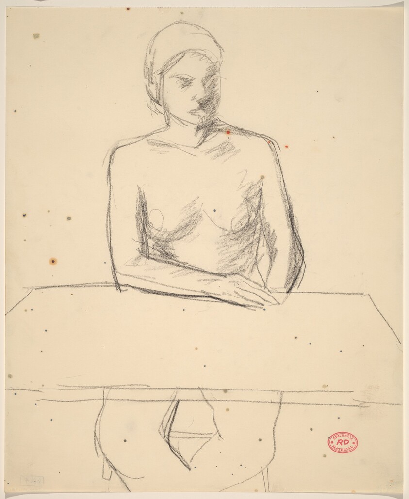 Untitled [woman seated at tabletop]