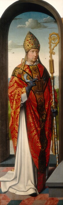 An older, pale-skinned man wearing a richly brocaded robe and bishop’s mitre stands under a rounded arch in front of a deep landscape in this tall, narrow, vertical painting. The man faces our right and has a deeply lined face with light brown eyes under thick brows, a long nose, and a pale, closed mouth. His dimpled chin and jowly neck are tinged with a five-o-clock shadow. The pointed gold mitre on his head is encrusted with pearls and ruby-red, olive-green, and dark gray gems. He wears a long white garment under a scarlet-red and shimmering gold brocaded robe. Bands down the shoulders and front of the robe show angels, an eagle, and a collection of objects. He wears marine-blue gloves and gold rings on both hands. One hand is held in front of his chest, the first two fingers extended. He holds a crozier, a staff with a gold, spiraling top, in the other hand. He stands on a pink and blue tiled floor near a gray step. The arched opening behind him gives way to a landscape with trees, gray stone towers, and distant blue hills under a pale blue sky.