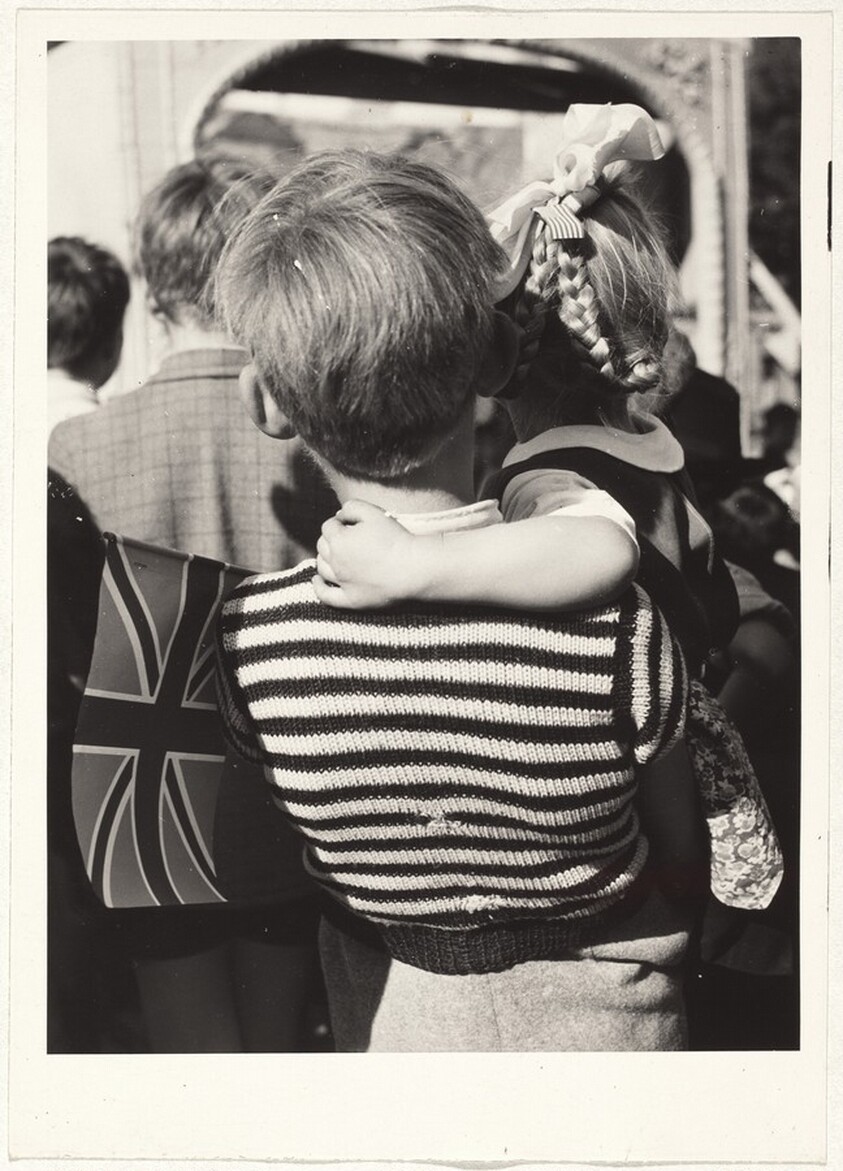 Child holding British flag at festival