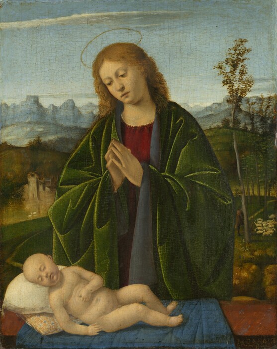 A woman stands over a sleeping infant in front of a deep landscape in this vertical painting. She has pale skin and light brown wavy hair. Her head tilts down to our left as her dark eyes gaze down at the infant lying on a ledge in front of her at about hip height, and her fingertips come together in front of her chest in prayer. A thin golden halo encircles the air above her head, and she wears thick robes of moss-green fabric with a dark blue lining over a crimson-red tunic. The collar of the tunic is edged with gold, and light reflects off the creases in the green robe where it bunches around her bent arms. The nude, bald infant lies on a blue cloth draped over a brown ledge in the bottom left corner of the panel. His body angles toward us as he lies back on two cushions. His eyes are closed, his lips slightly parted, and his left hand rests across his belly. A landscape behind the pair stretches out from rolling green hills to pale blue mountains in the distance. A thin white cloud spreads across the top of the blue sky. A building is nestled into the hills to the left, and tall spindly trees grow up the right edge of the panel. A man dressed in a brown tunic and hat leans on a staff near the tree, watching a cluster of white sheep. A narrow dirt path winds from the left side of the painting to the right and through the trees. Cracks on the surface of the painting are visible throughout and are especially noticeable in the sky. The artist signed the lower right corner of the painting on the edge of the ledge facing us: “M. BASAITI/P.”