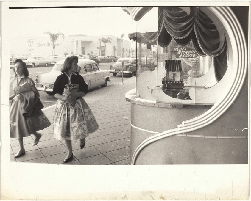 Two women outside movie theater--Los Angeles