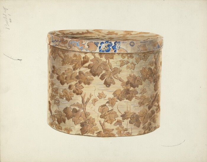 The image displays a large oval-shaped box with a floral pattern in shades of brown, beige, and blue. The box is adorned with intricate leaf and floral designs on its sides and top. There is a simple, light background with minimal text and an arrow-like mark on the left side of the image.