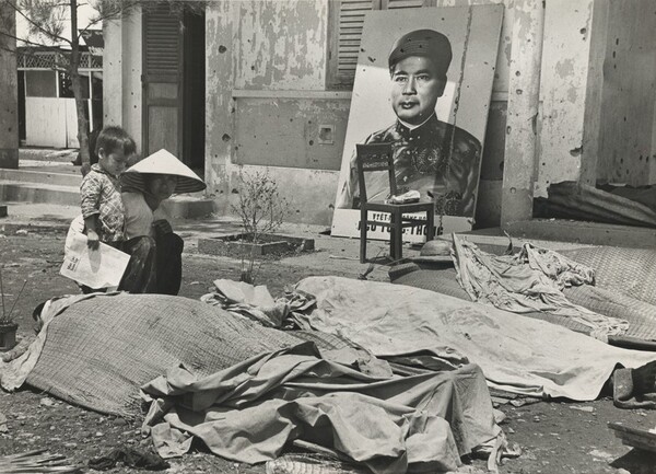 Title from caption on object: “Son Watched as Woman Knelt at the Body of Her Husband”