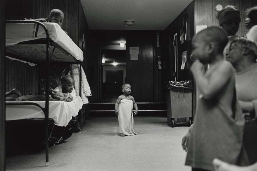 I rarely saw kids in the shelter play. Shelter life is a serious game. This baby waits anxiously for his mama to take him to bed. Olive Branch Mission, Chicago.