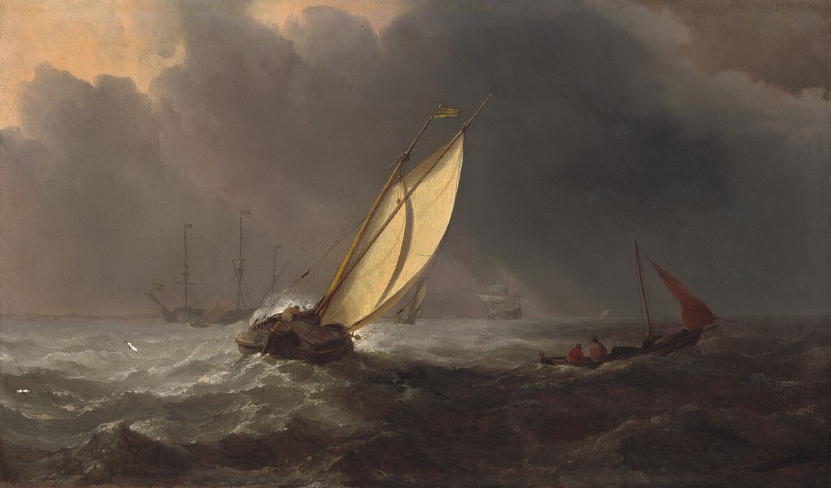 We look across choppy waves at a sailboat canting at a sharp angle, with several others floating nearby or in the distance, all beneath a sky filled with charcoal-gray clouds in this horizontal painting. In the bottom third of the canvas, the battleship-gray waves are topped with frothy white crests. The boat closest to us is slightly left of center, and its mast tips wildly to our right. Sunlight catches the straw-yellow sail as it pulls taut in the wind. At least two men crouch or bend over in the wooden vessel below, as white spray kicks up off the far side of the boat. Two white seagulls, tiny in scale, fly closer to the water’s surface to our left of that boat. The next closest vessel is to our right, and it is nearly swallowed in shadow. Two men huddle at one pointed end of the narrow boat, and a crimson-red sail flaps loosely in the wind. At least four more boats in the distance, along to the horizon, range in size from a small sailboat to a three-masted ship. The sail of the smallest boat also tips sharply to our right, but the tall masts of the ship are upright, and those sails are furled. Dark clouds billow up from the horizon, but break near the upper left corner. The sky beyond is pale apricot peach, and a few streaks of light reach the water’s surface.