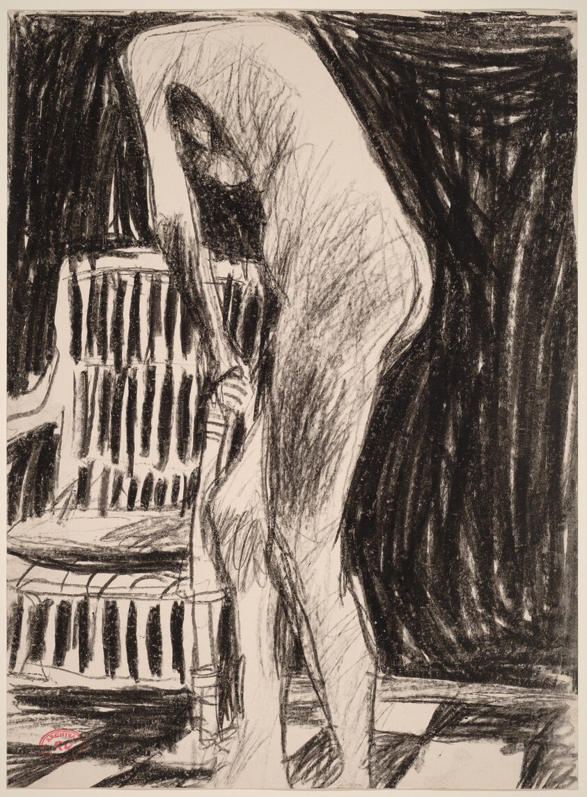 Untitled [standing female nude holding the arm of a chair]