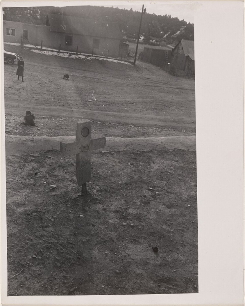 Grave with children playing nearby--Santa Fe, New Mexico
